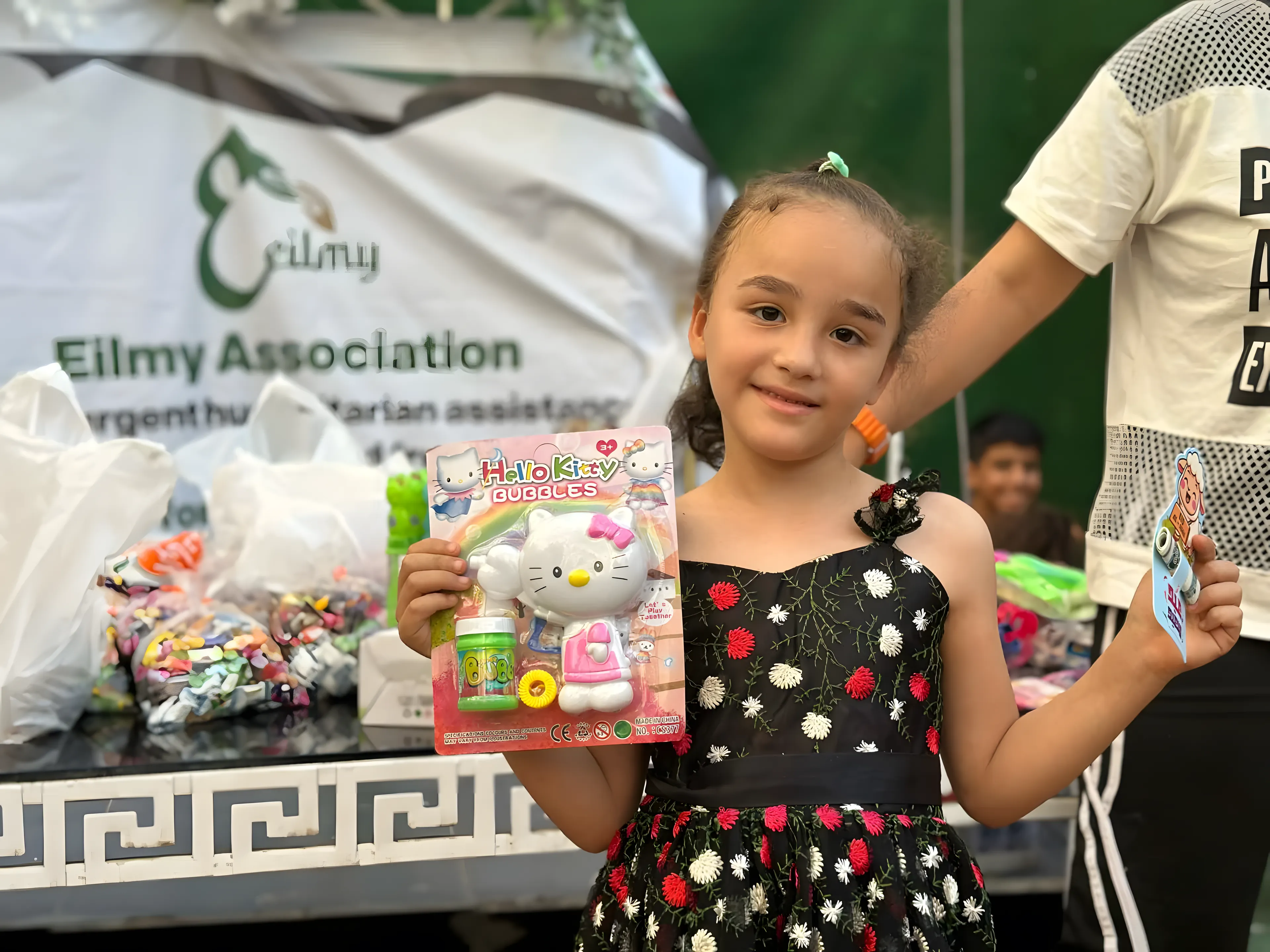 Giving a gift to a young girl.
